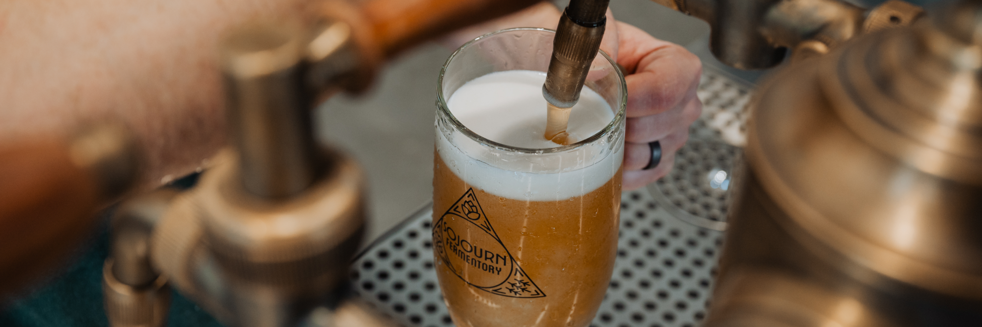 Sojourn Beer and Cider taproom with house pilsner and dry cider